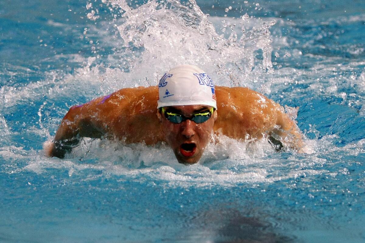 Olympian Michael Phelps swims the butterfly at the Lee & Joe Jamail Texas Swim Center on March 6.