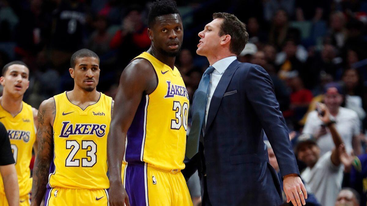 Lakers forward Julius Randle stands in front of coach Luke Walton after he was ejected from a game against New Orleans on Feb. 14.