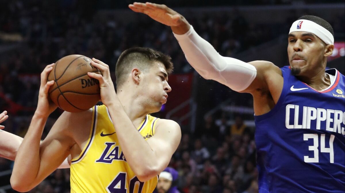 Center Ivica Zubac, going against former Clippers forward Tobias Harris in a January game, is not having any disruption off the court after being traded from the Lakers to the Clippers.