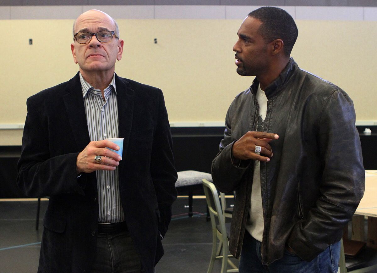 Actors Robert Picardo and Jason George, both jurors in the play "Twelve Angry Men" rehearse a scene at the Pasadena Playhouse rehearsal studio in Pasadena on Tuesday, Oct. 29, 2013.