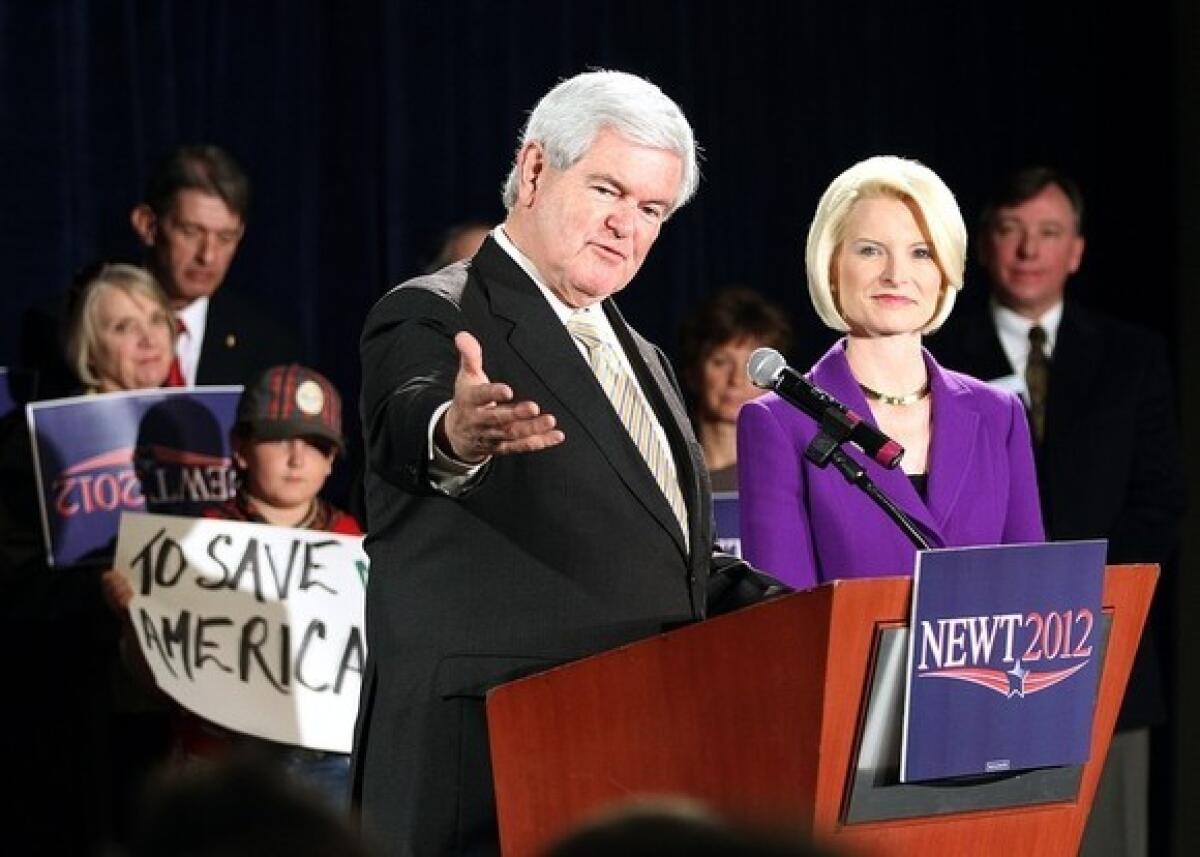 Newt Gingrich speaks during a campaign rally alongside his wife, Callista, at the Marriott Denver West on Monday in Golden, Colo.