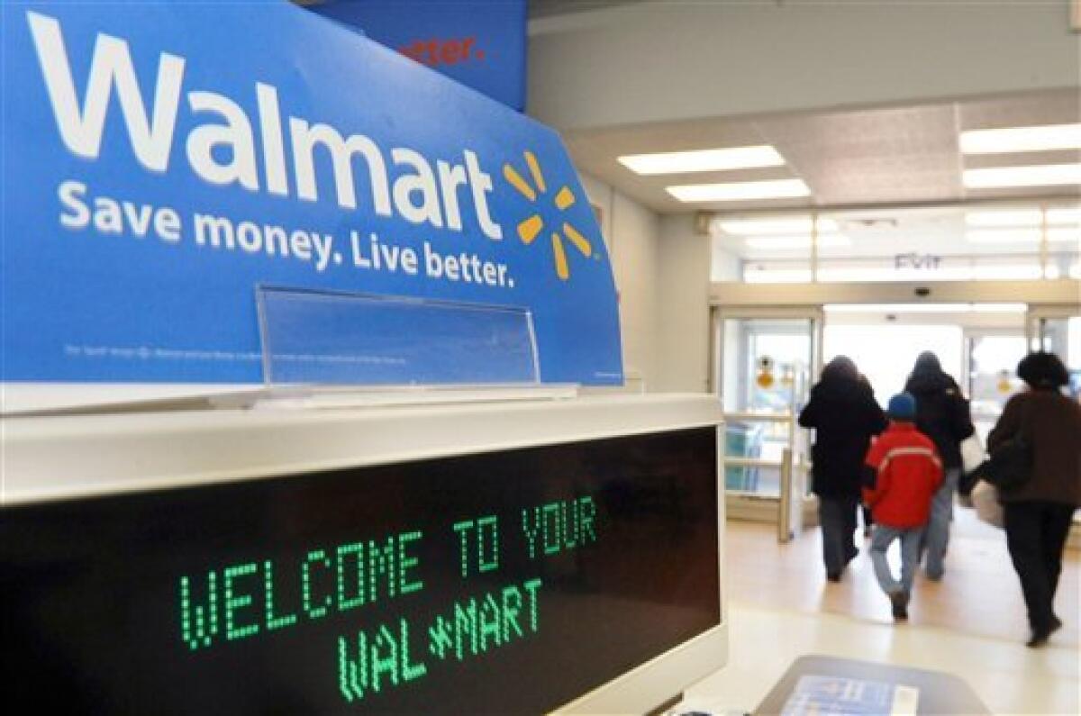 Wal-Mart lowered its fiscal fourth-quarter and full-year forecasts.