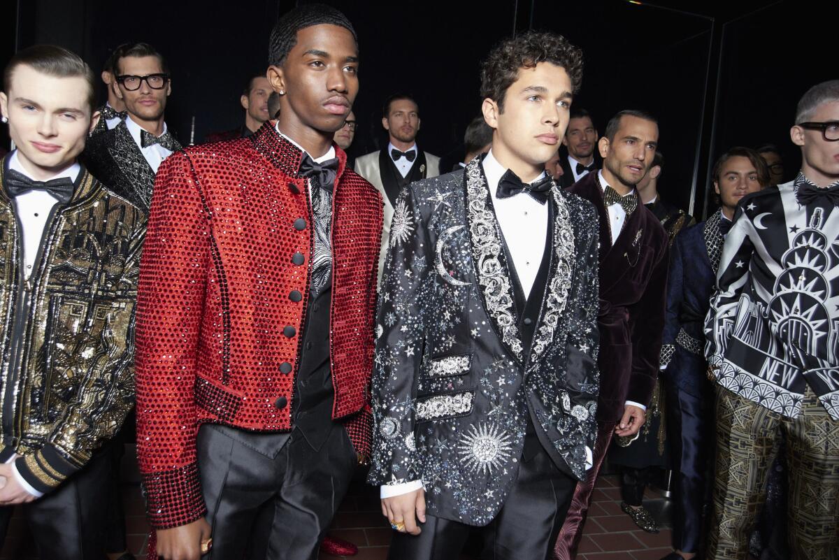 Jack Marsden, from left, Christian Combs and Austin Mahone wait backstage at Dolce & Gabbana's Alta Sartoria show at the Rainbow Room in New York on April 7.