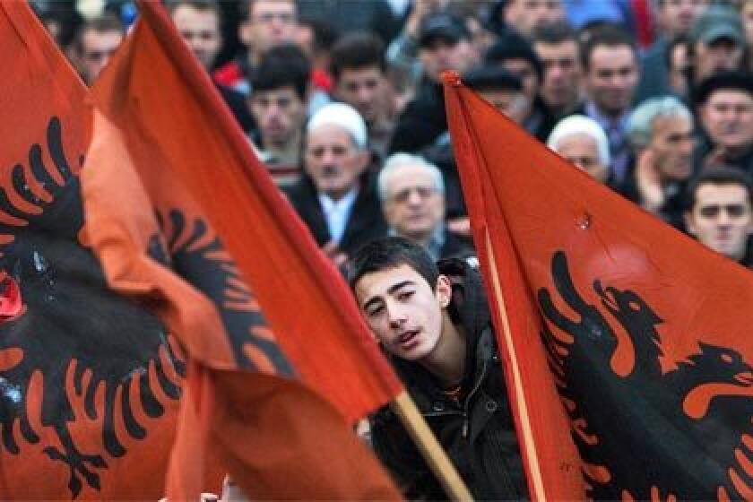 INDEPENDENCE CRY: Kosovo Albanians rally in Pristina, the provincial capital, to press their leaders to follow through with promises of independence from Serbia.