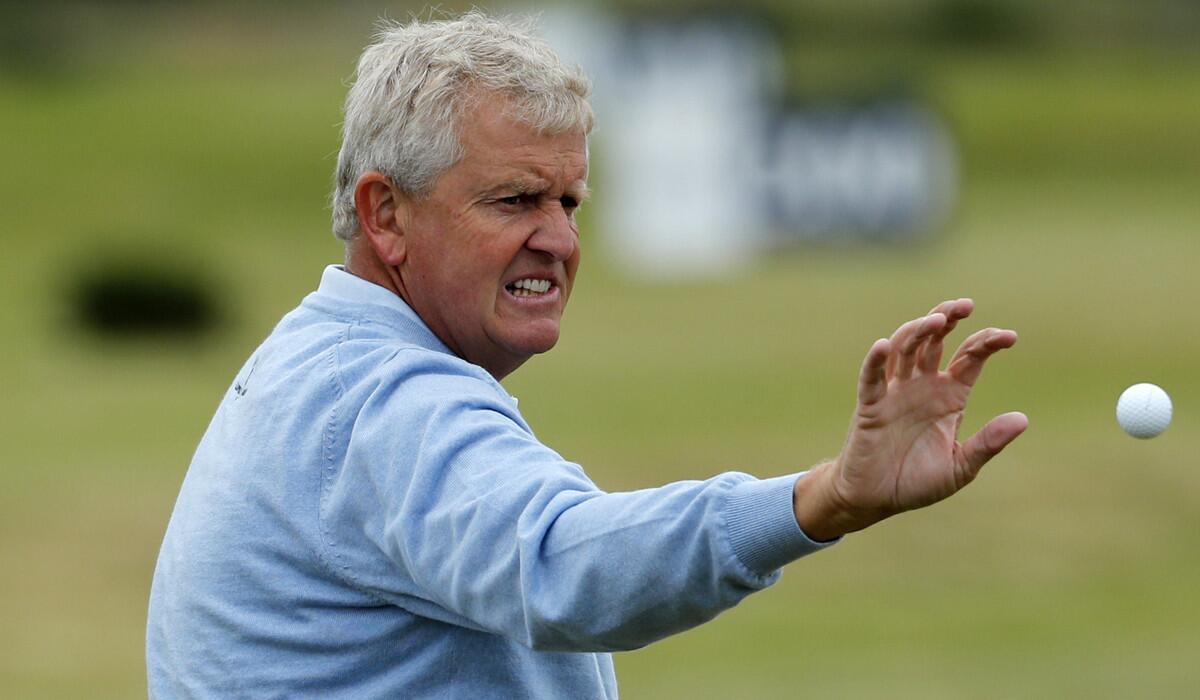 Colin Montgomerie catches a ball Tuesday during practice ahead of the British Open.