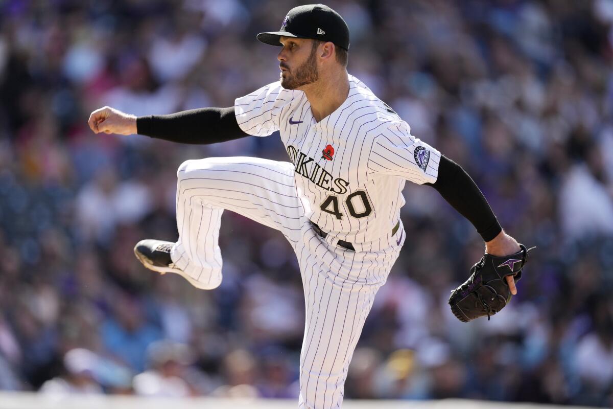 Colorado Rockies relief pitcher Tyler Kinley works against the Miami Marlins in the eighth inning of a baseball game Monday, May 30, 2022, in Denver. (AP Photo/David Zalubowski)