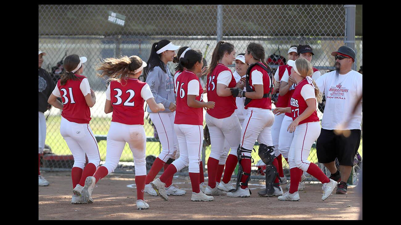 Burroughs High School softball team celebrates their CIF SS Div. 3 first round win vs. Bonita High at Las Flores Park in La Verne on Thursday, May 17, 2018. Pitcher Presley Miraglia threw a shutout and won the game 2-0.