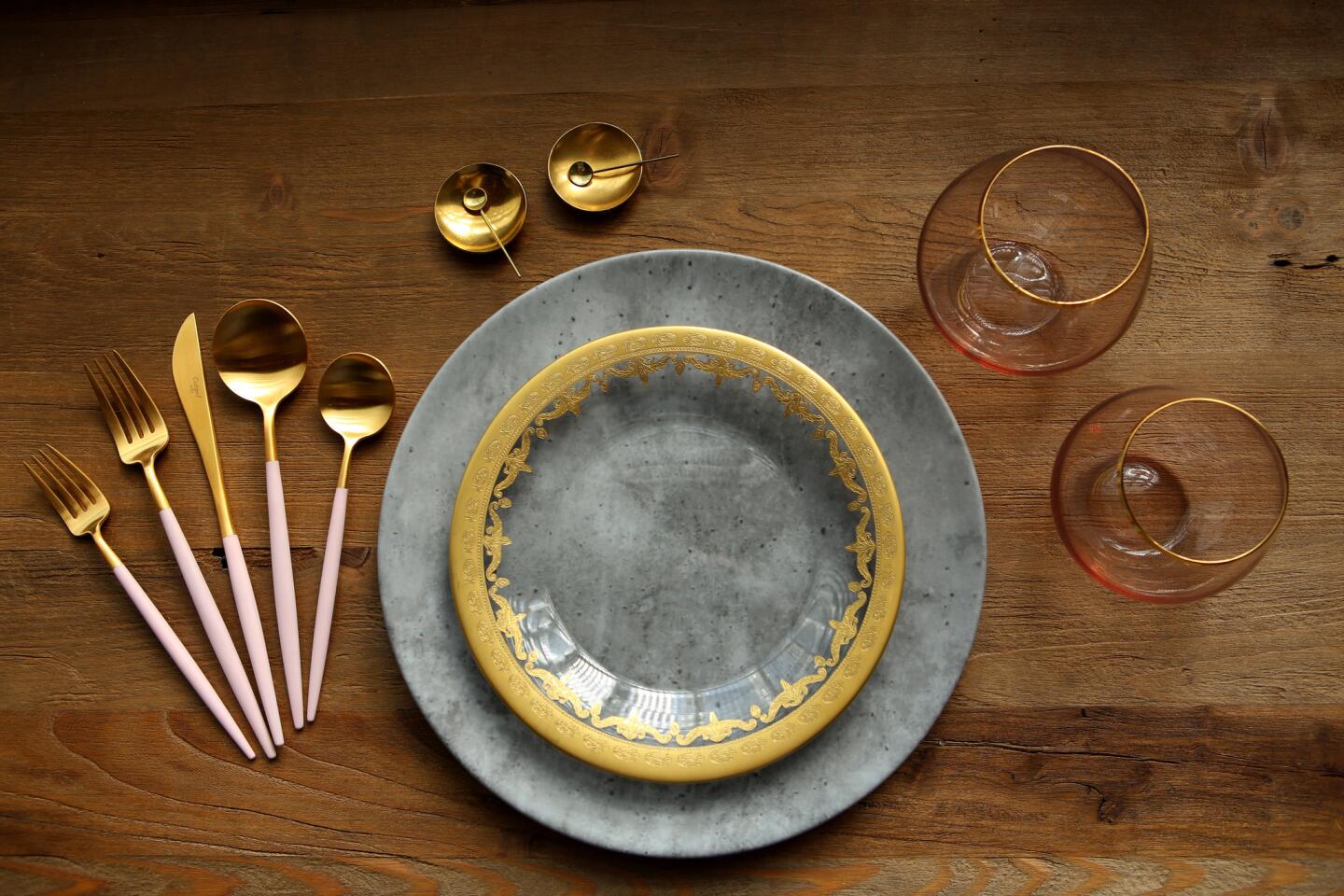 To create a striking place setting for your Thanksgiving feast, Diana and Josh Perrin suggest starting with the most basic element -- your plates -- and designing around them.