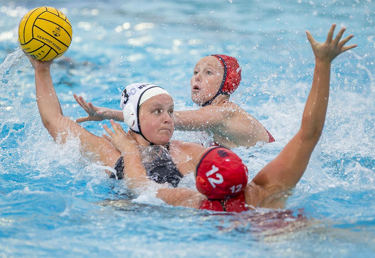 Newport Harbor's Ryan Chalupnik takes a shot under pressure from San Marcos on Dec. 29, 2022.