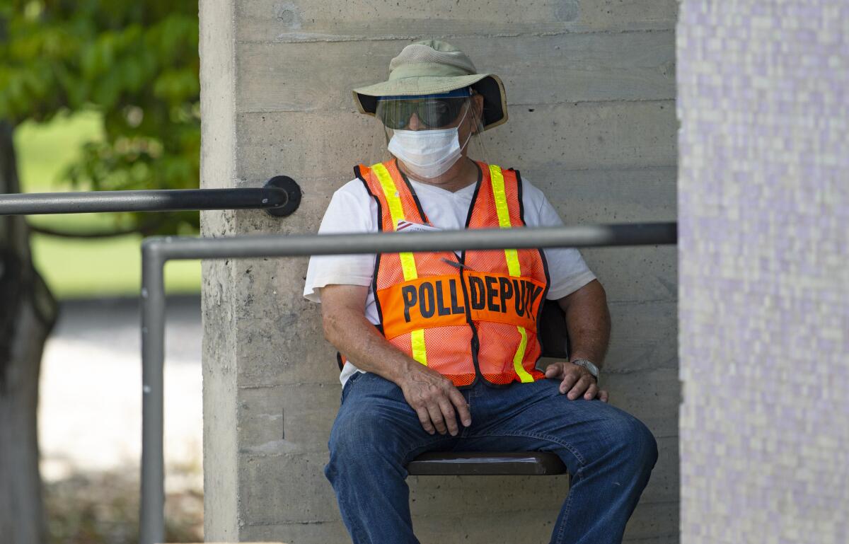 A polling worker in Miami