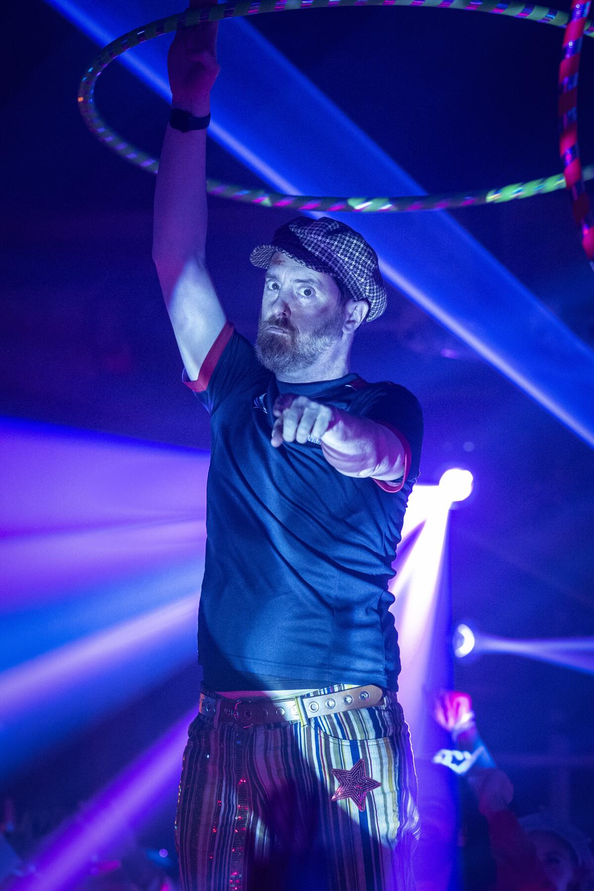 Brendan Hunt twirls a hula hoop in a nightclub in the "Beard After Hours" episode of "Ted Lasso."