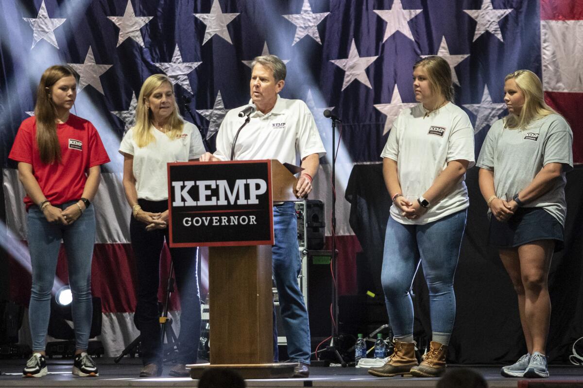 Gov. Brian Kemp announces his bid for re-election at the Georgia National Fairgrounds surrounded by his family on Saturday, July 10, 2021 in Perry, Ga. (Clay Teague/The Macon Telegraph via AP)