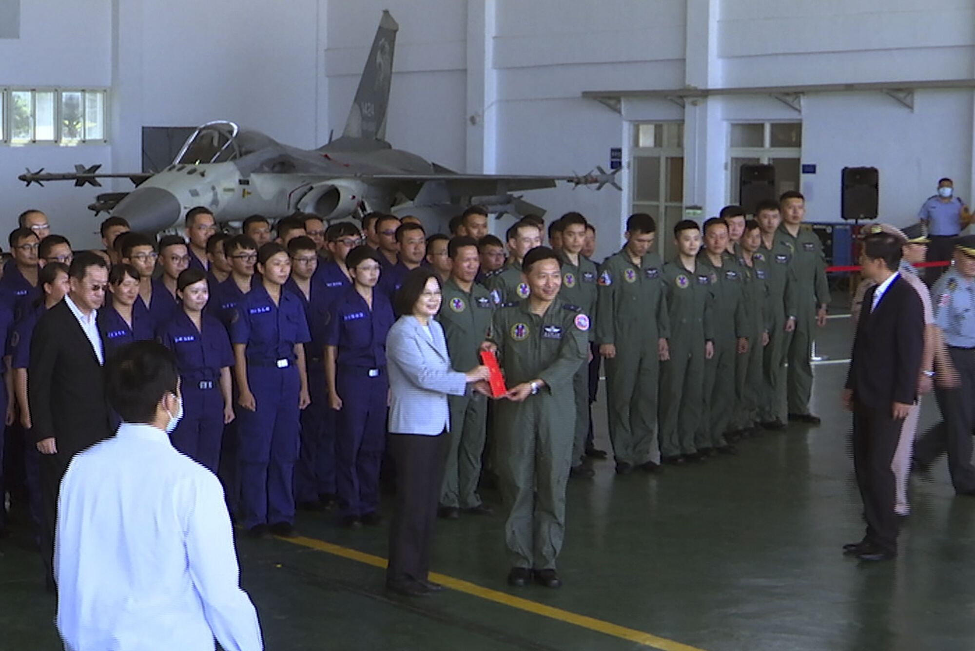 Taiwan President Tsai Ing-wen, center left, has been working to promote military service.