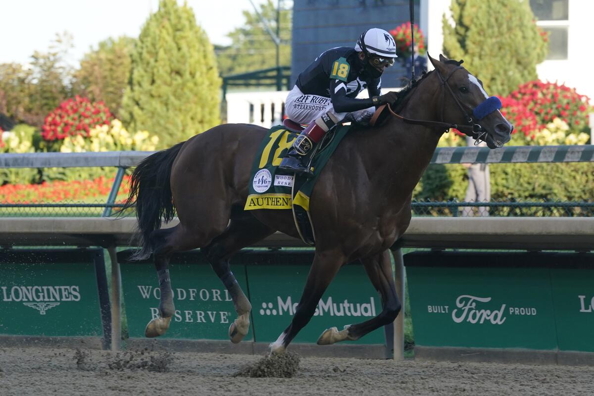 Jockey John Velazquez rides Authentic to victory in the 146th Kentucky Derby at Churchill Downs.