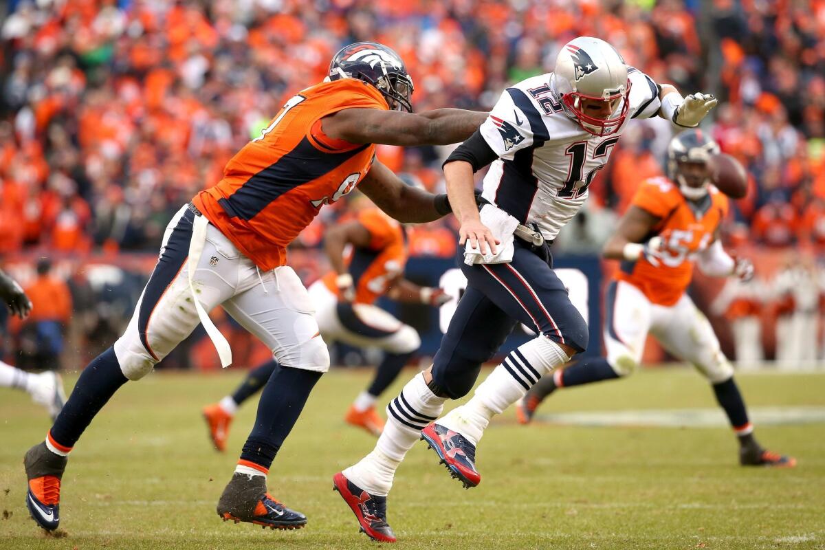 Broncos' Malik Jackson pressures Tom Brady in the AFC Championship game.
