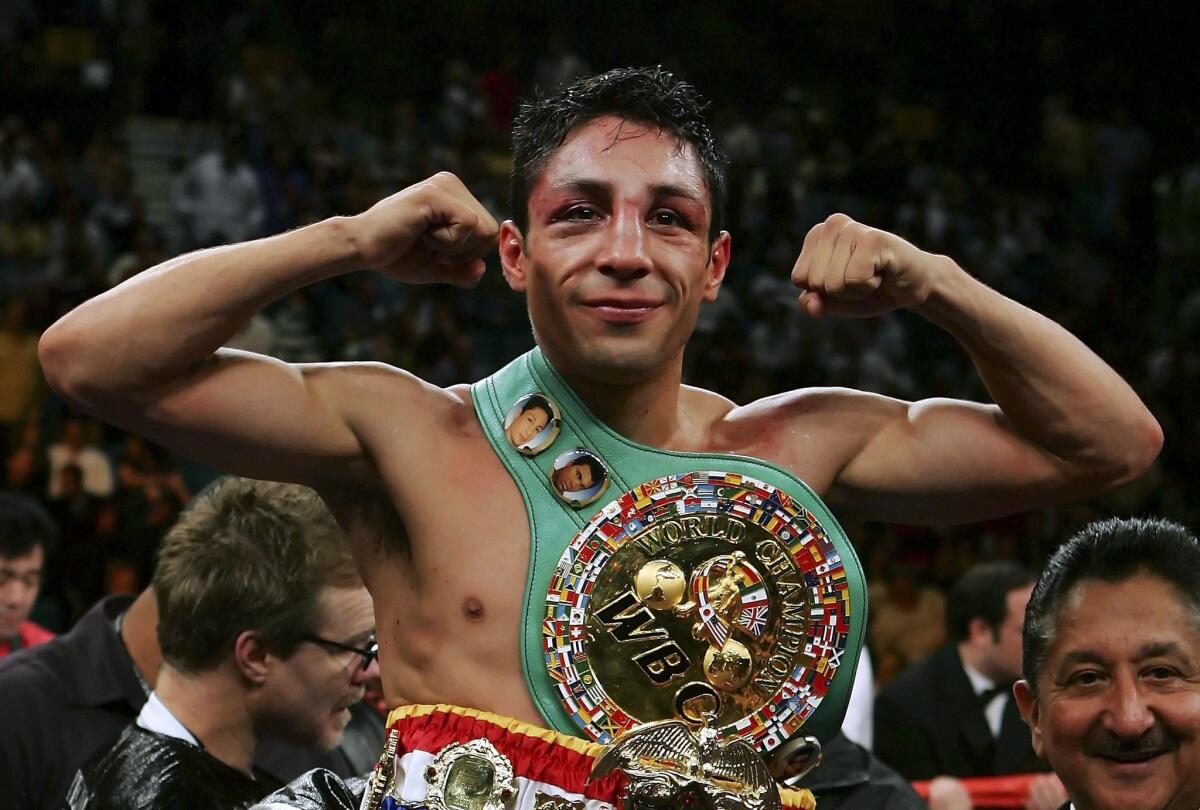 LAS VEGAS - SEPTEMBER 16: Israel Vazquez celebrates after defeating Jhonny Gonzalez of Mexico after their WBC super bantamweight titile fight at the MGM Grand Garden Arena September 16, 2006 in Las Vegas, Nevada. Vazquez retained his title after defeating Gonzalez by TKO in the 10th round.