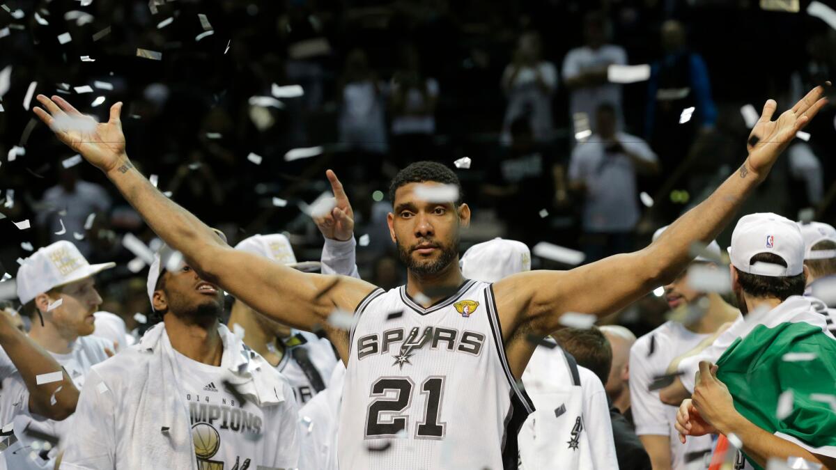 San Antonio Spurs forward Tim Duncan celebrates after Game 5 of the NBA basketball finals in San Antonio on June 15, 2014.