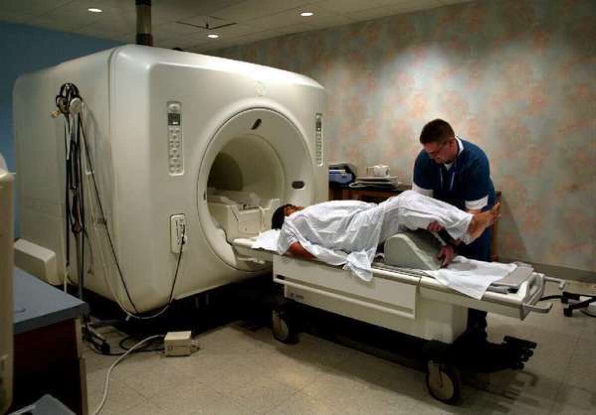 A patient gets an MRI of the lower back. Researchers said Monday that diagnostic tests don't always reassure patients who worry about symptoms but are unlikely to be seriously ill.