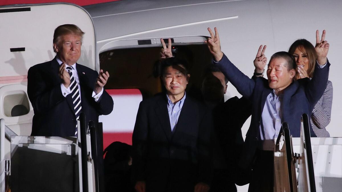 President Trump and First Lady Melania Trump greet three Americans released from North Korea upon their arrival at Joint Base Andrews in Maryland on May 10.