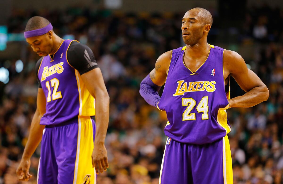 Dwight Howard and Kobe Bryant had an interesting season together with the Lakers. (Jared Wickerham / Getty Images)