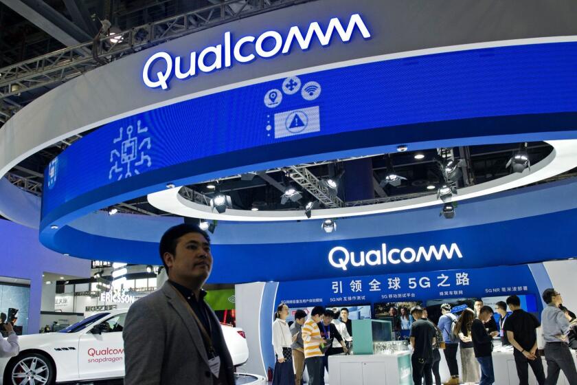 GUANGZHOU, CHINA - DECEMBER 06: Attendees visit the Qualcomm stand during China Mobile Global Partner Conference 2018 at Poly World Trade Center Exhibition Hall on December 6, 2018 in Guangzhou, Guangdong Province of China. The three-day conference opened on Thursday, with the theme of 5G network. (Photo by VCG/VCG via Getty Images) ** OUTS - ELSENT, FPG, CM - OUTS * NM, PH, VA if sourced by CT, LA or MoD **