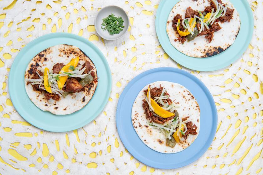 LOS ANGELES, CA-June 28, 2019: Instant Pot Hatch Chile Pork Tacos with Kohlrabi Mango Slaw on Friday, June 28, 2019. Food styling by Genevieve Ko. (Mariah Tauger / Los Angeles Times)
