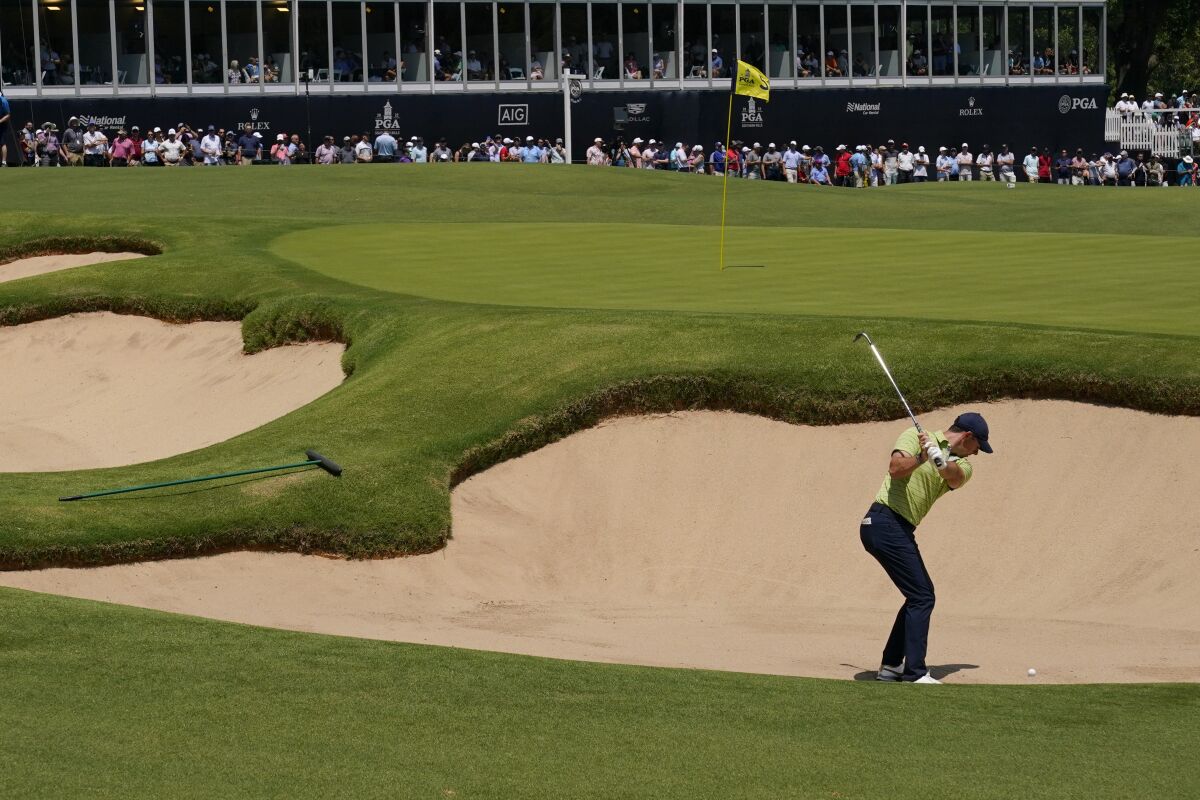 Rory McIlroy hits from the bunker on the fifth hole during the first round of the PGA Championship on Thursday.