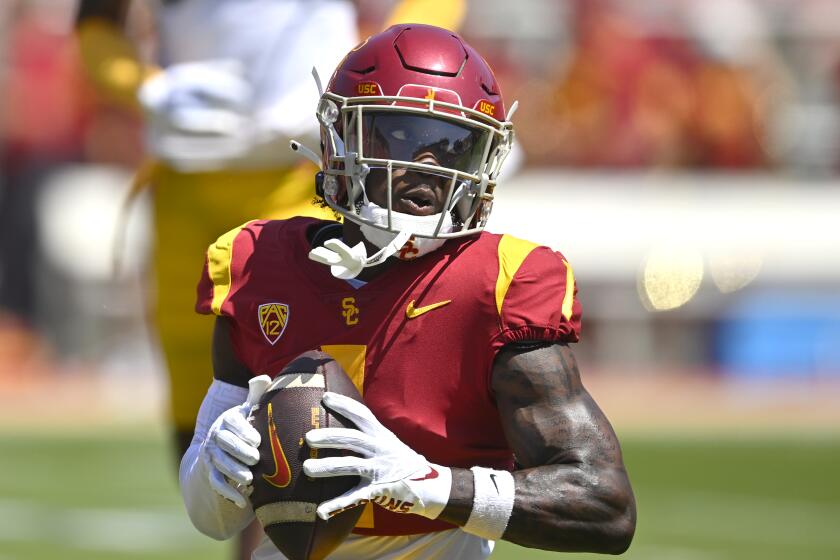 LOS ANGELES, CA - APRIL 15: Wide receiver Zachariah Branch #1 of the USC Trojans warms up.