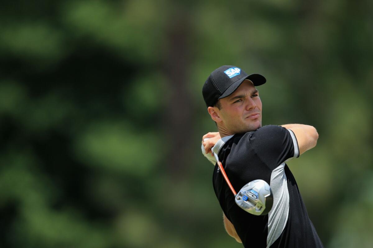 Martin Kaymer watches his tee shot on the eighth hole during the second round of the 114th U.S. Open on Friday.
