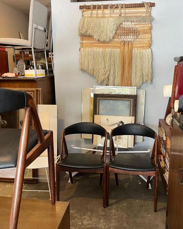 Chairs and a wall hanging on display at Design Utopia in Hollywood.