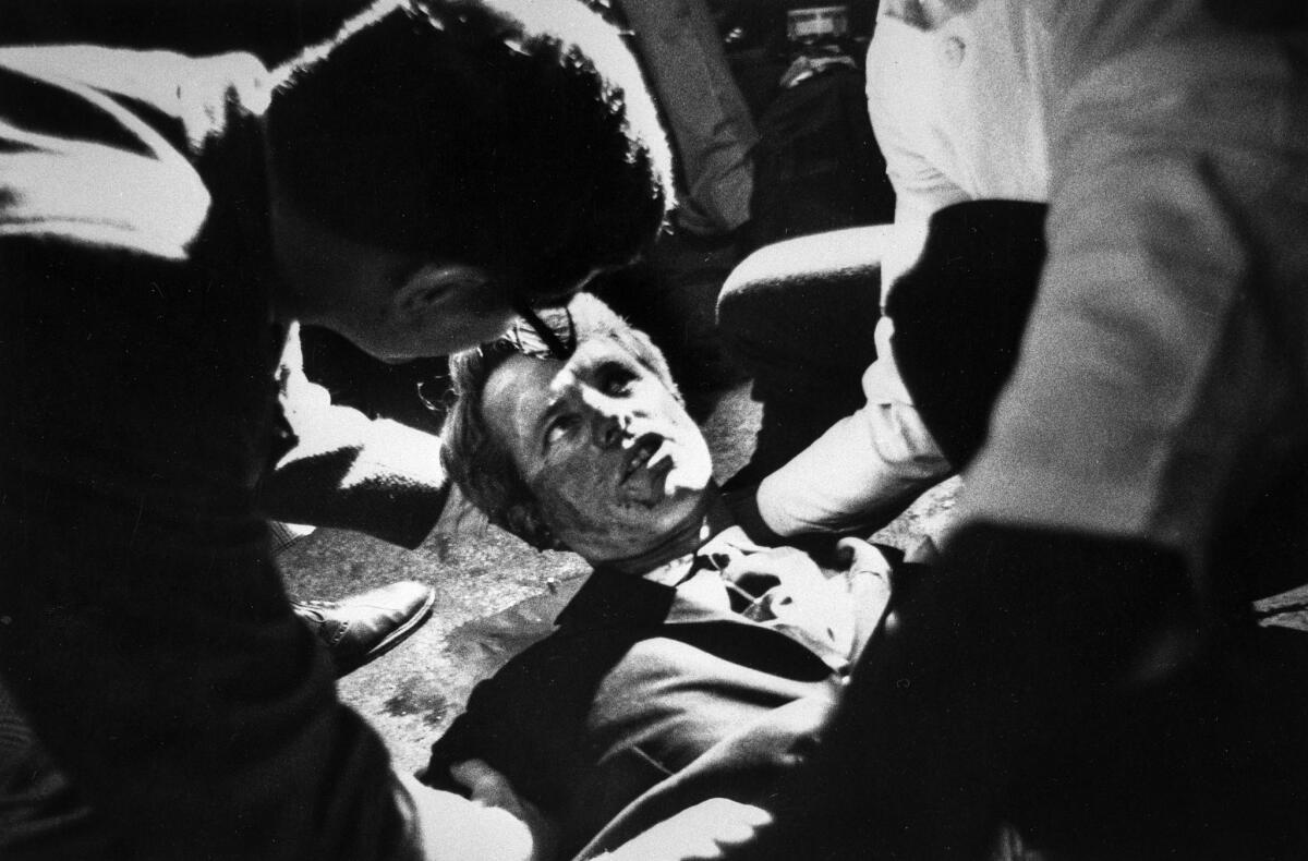 June 5, 1968: Presidential candidate Robert F. Kennedy lies on the floor at the Ambassador Hotel in Los Angeles moments after he was shot in the head.