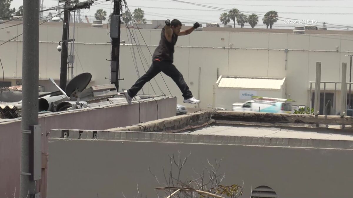 Suspect jumps from one roof to another during standoff in National City