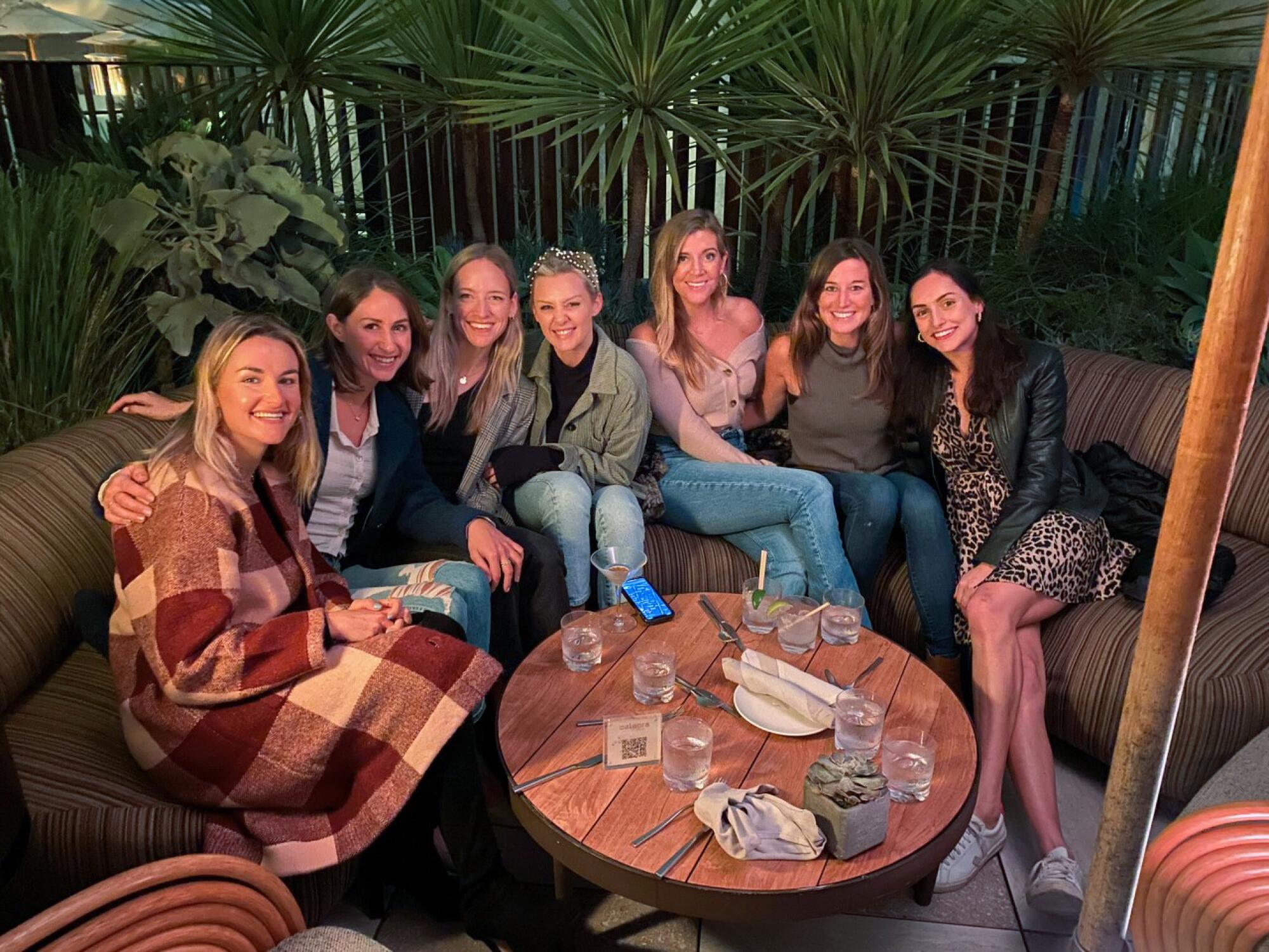 A group of people sitting on a couch.