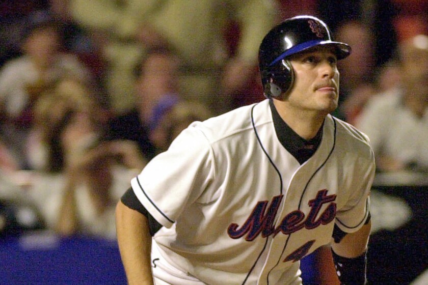 FILE - New York Mets Robin Ventura watches the path of his grand slam hit off Houston Astros pitcher Jay Powell in the seventh inning of a baseball game on May 1, 2001, at Shea Stadium in New York. The Mets announced Tuesday, Feb. 8, 2022, the return of Old-Timers Day for the first time since 1994. (AP Photo/Kathy Willens, File)