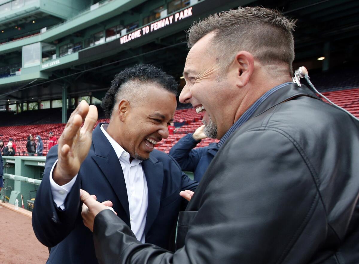 Manny Ramirez, left, apologized for his behavior while he played with the Red Sox before a pregame ceremony Wednesday honoring Boston's 2004 World Series championship team.