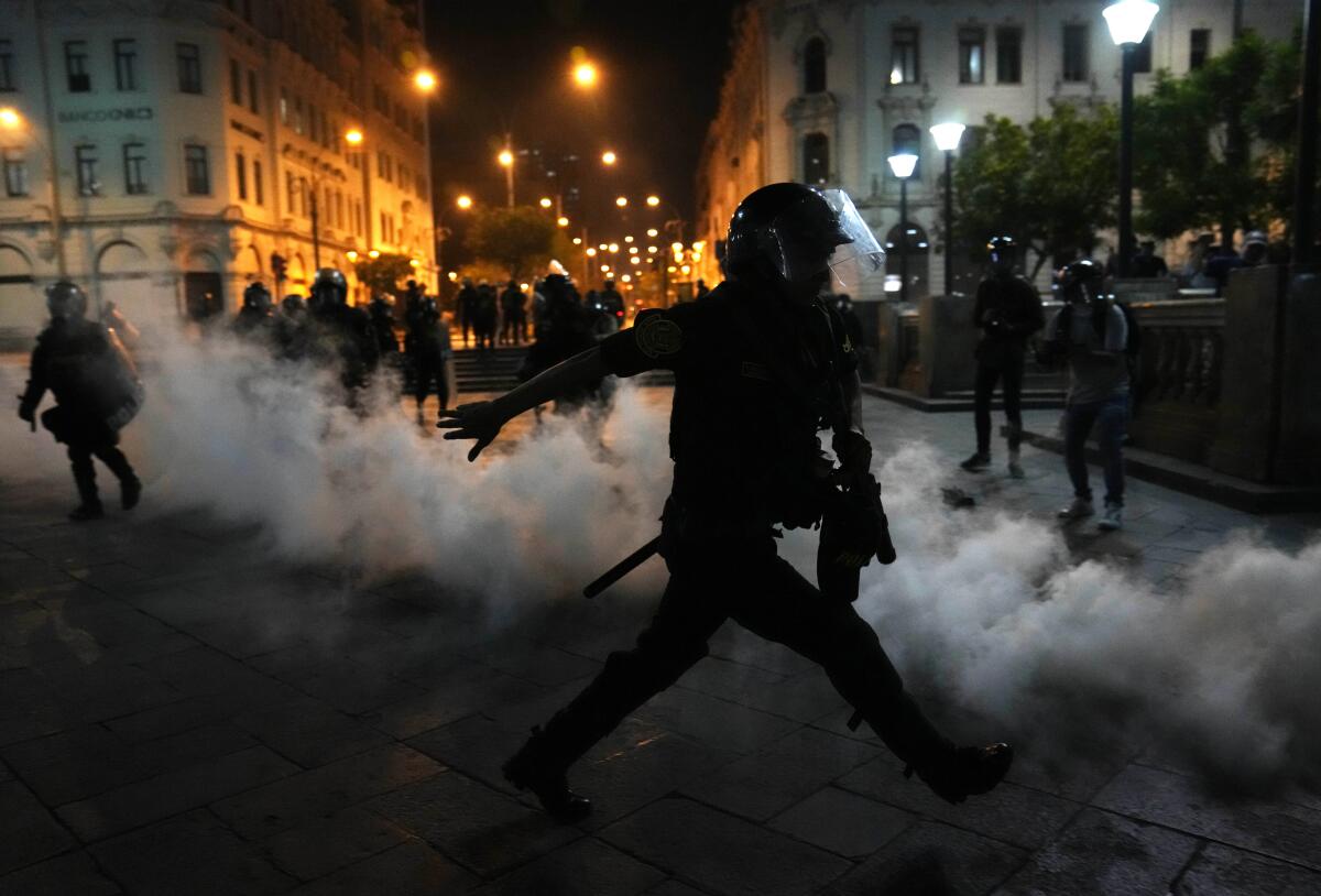 Tear gas billowing amid street protests in Lima, Peru