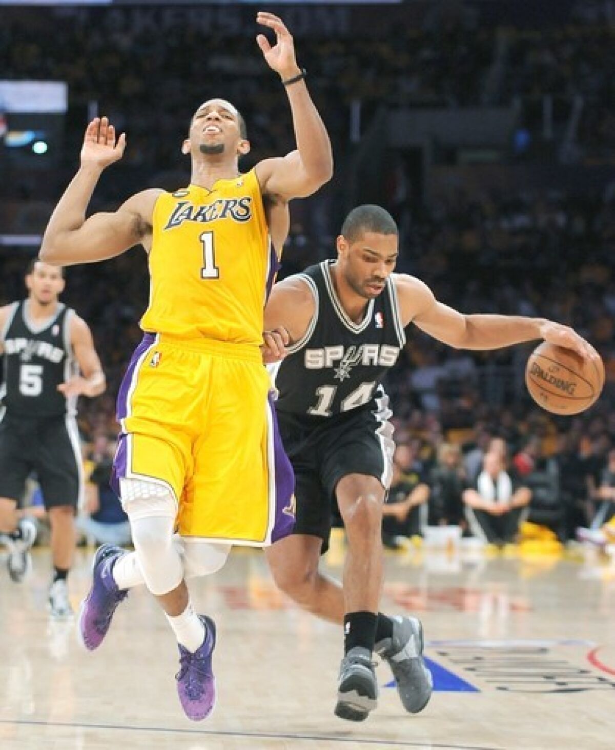 Lakers guard Darius Morris contests a breakaway by Spurs guard Gary Neal in Game 3 of their first-round playoff series on April 26.