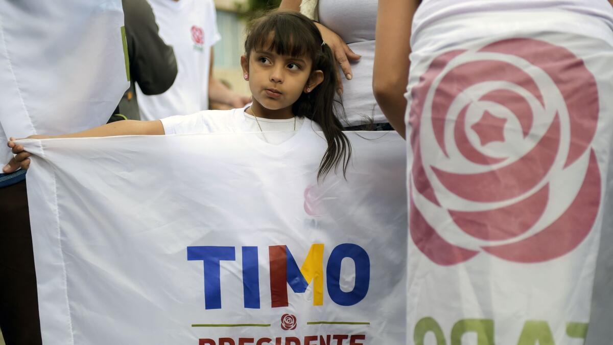 Roses, a new emblem for the former Colombian rebel group FARC, were on wide display at a political rally Saturday in Bogota.