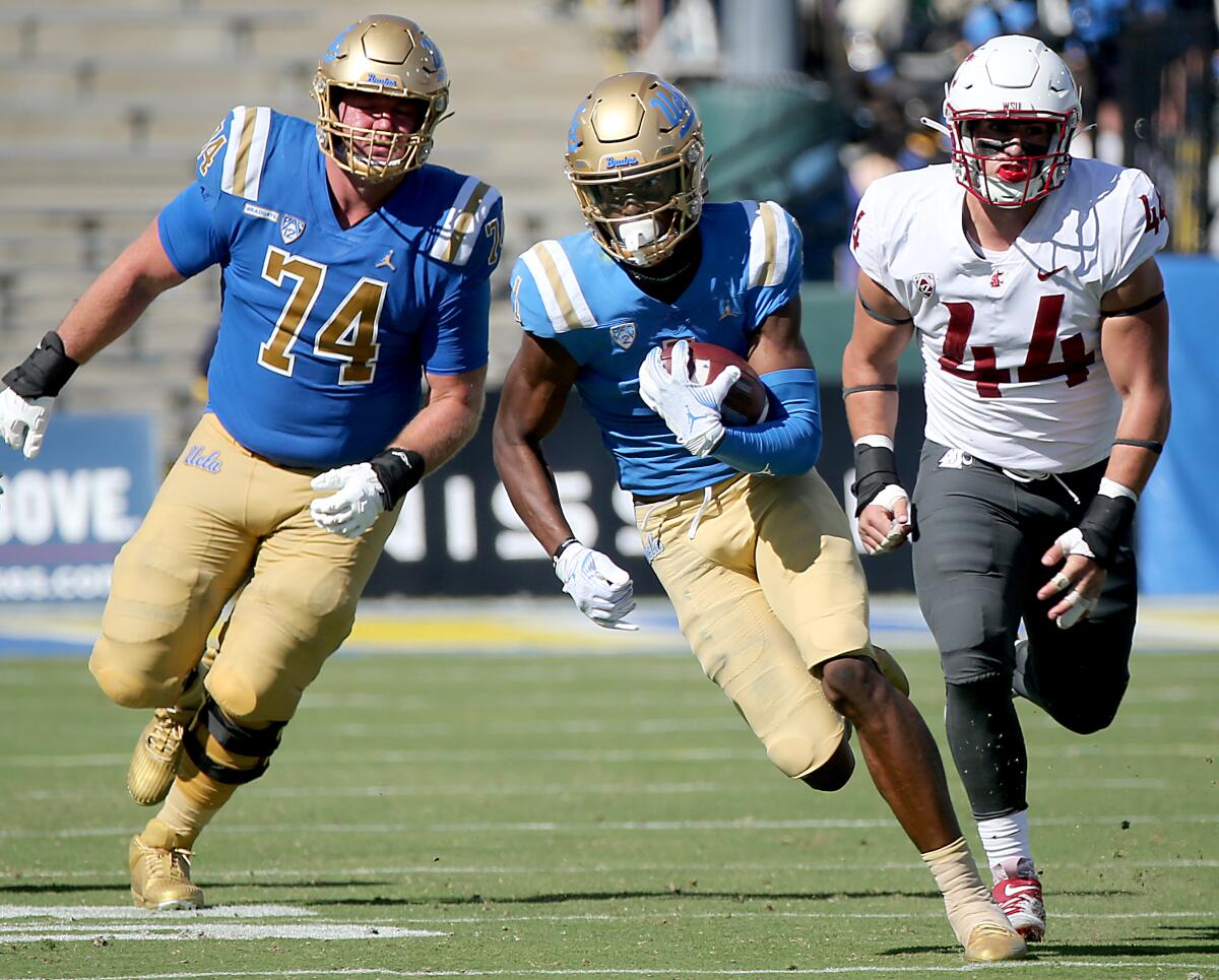 UCLA wide receiver J.Michael Sturdivant runs with the ball after making a reception against Washington State.