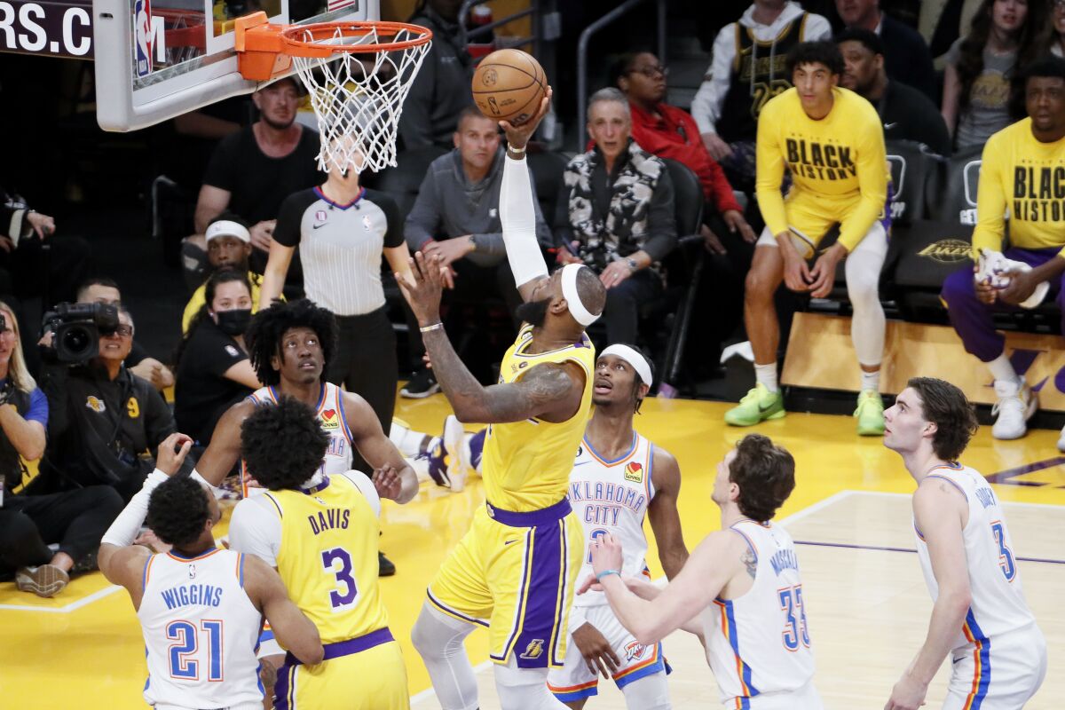 Lakers forward LeBron James releases a layup after a drive down the lane.
