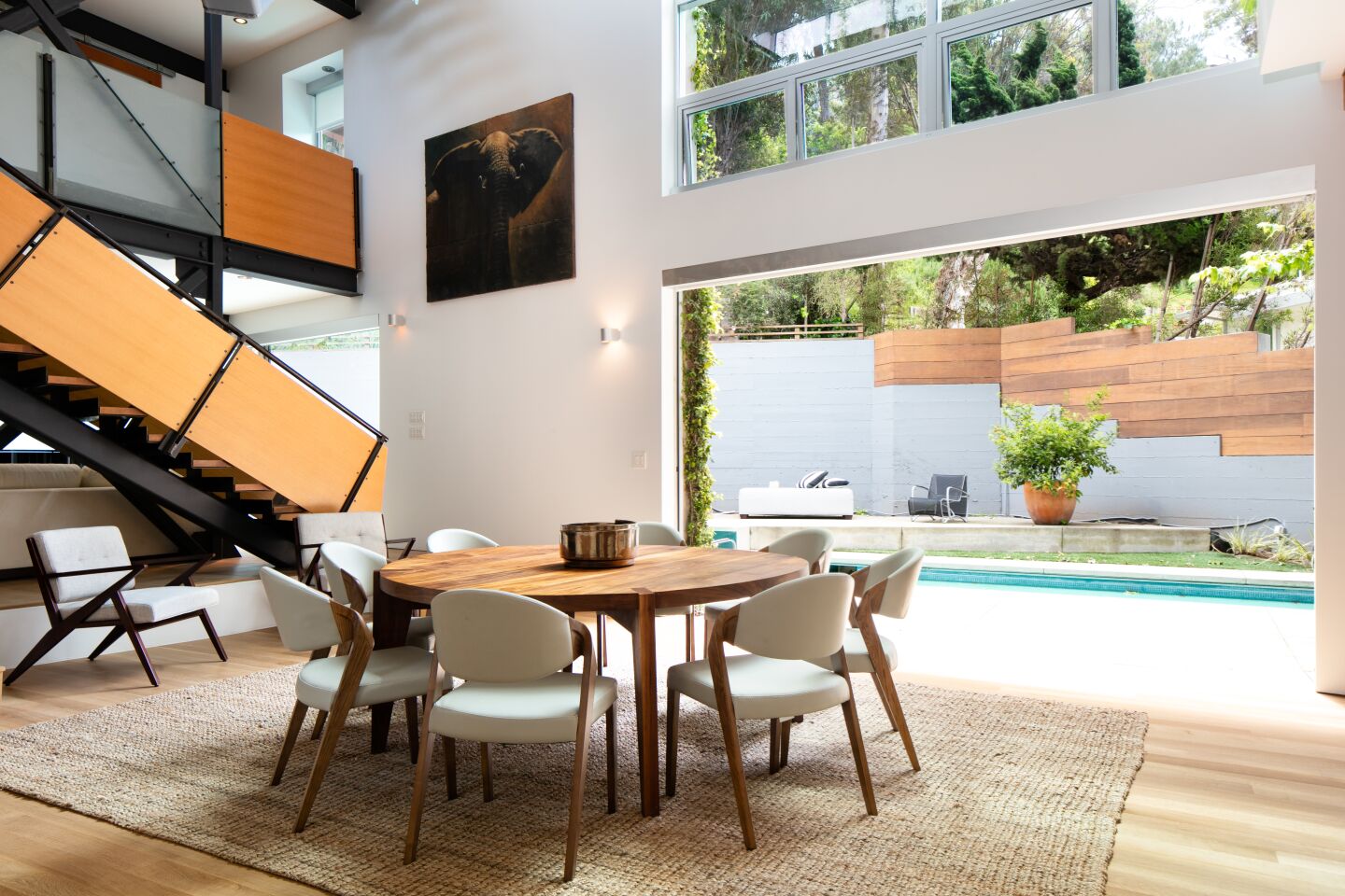 Features include pocketing doors and clerestory windows.