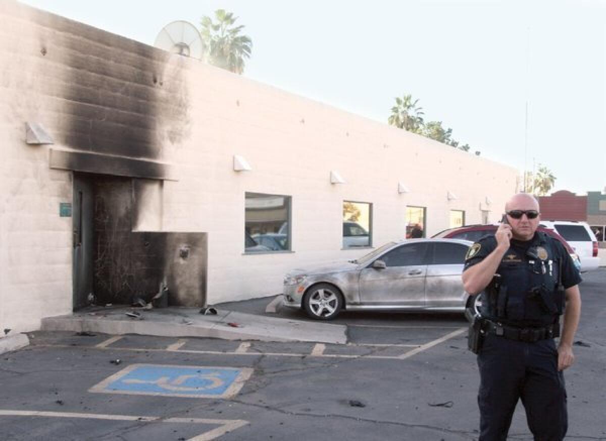 Police investigate an explosion at the Social Security Administration office in downtown Casa Grande, Ariz.