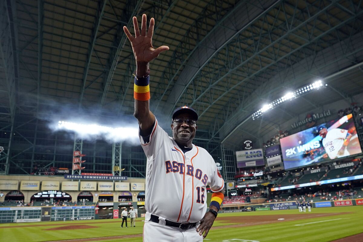 Houston Astros manager Dusty Baker Jr. celebrates after a baseball game against the Seattle Mariners Tuesday, May 3, 2022, in Houston. The Astros won 4-0 giving Baker 2,000 career wins. (AP Photo/David J. Phillip)