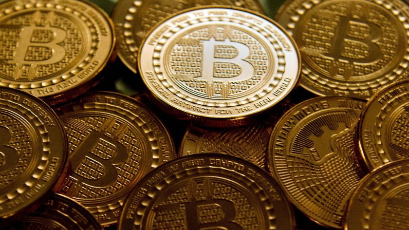 Medallions bearing the bitcoin symbol.