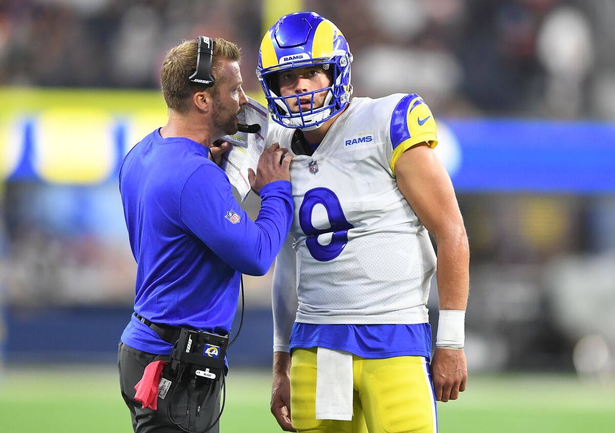  Rams head coach Sean McVay conveys a play to quarterback Matthew Stafford.