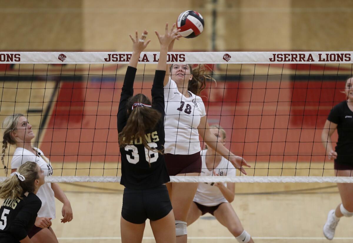 Luisa LoFranco (18) scores for Laguna Beach against JSerra's Sophia Jaroz (36) during the first set of a nonleague road match on Wednesday.