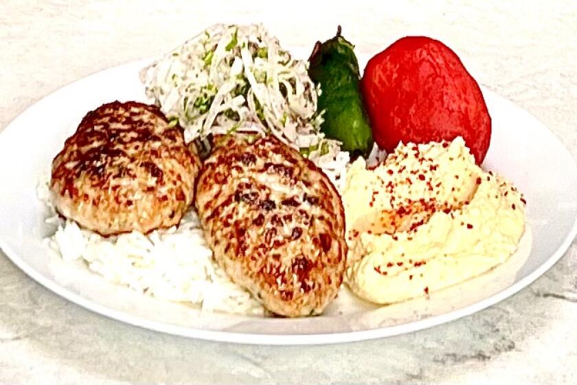 Mini Kabob's chicken cutlet, served with basmati rice, sumac onions, hummus and charred tomato.