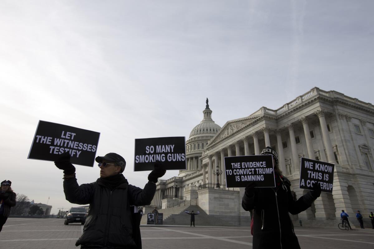 Demonstrators protest outside the U.S. Capitol.