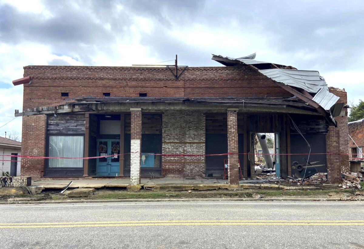 In this photo provided by Jennifer Cassity, storm damage to the Faunsdale Bar and Grill, a popular spot in Faunsdale, Ala., is shown on Thursday, March 31, 2022. Located in an old building in a once-thriving town, the business was hit by a storm that moved through rural west Alabama. The loss of the well-known entertainment venue was a blow to the community of less than 100 people. (Jennifer Cassity via AP)