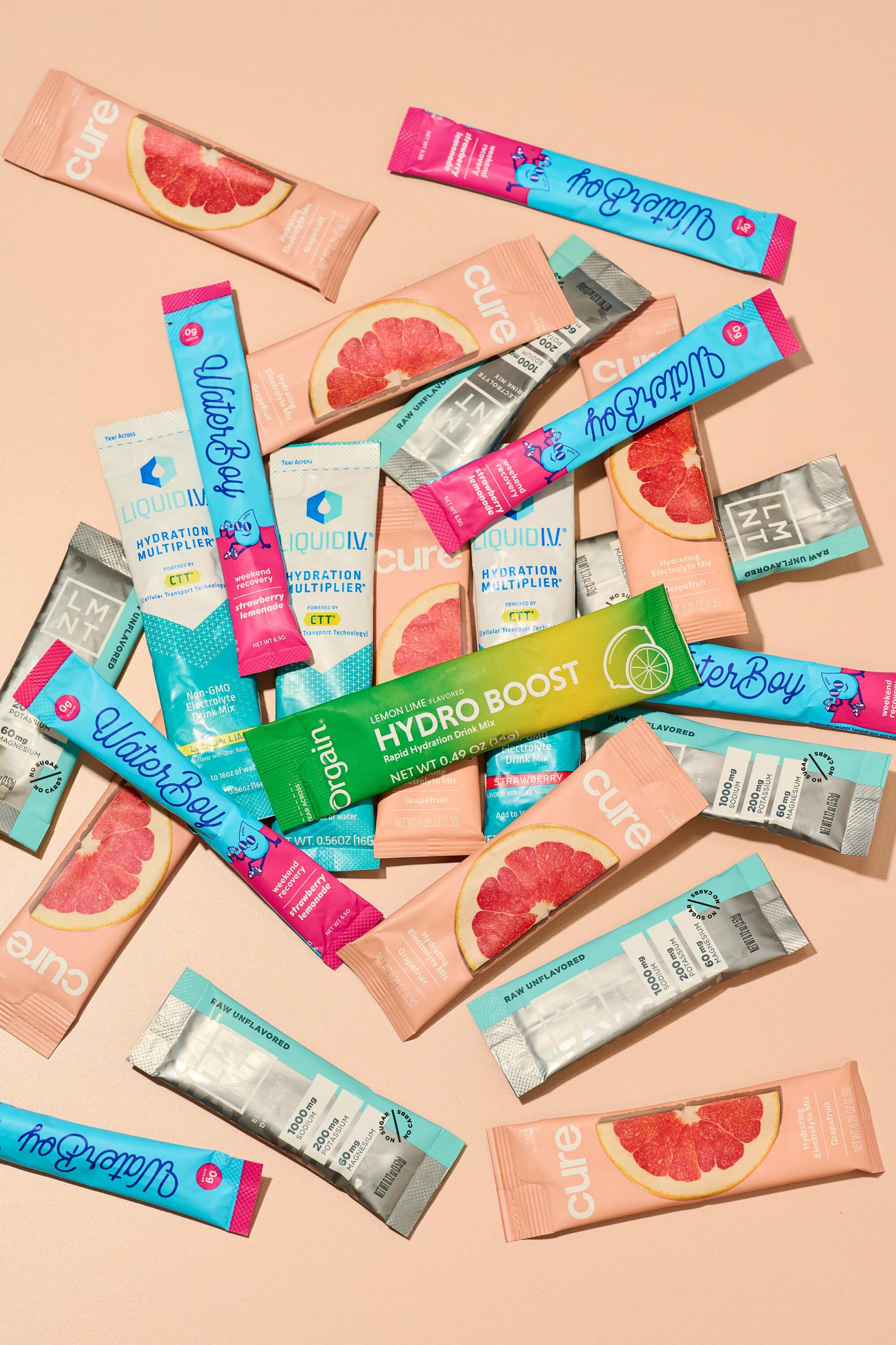 A variety of colorful water supplement packets.